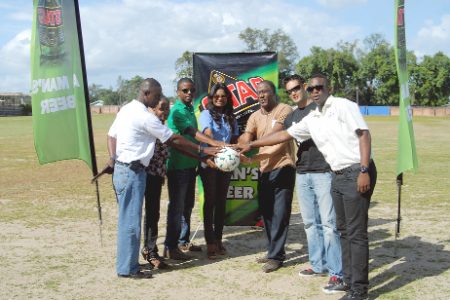 Representative of Ansa McAl Trading Limited and handlers of the MSC ground, pose for a photo opportunity after the simple handing over ceremony of the newly resurface playing field. (Orlando Charles photo)
