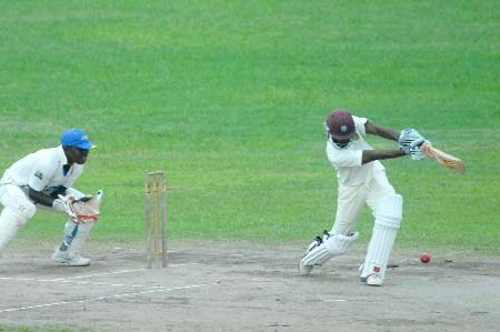 Rajendra Chandrika drives through the off-side on his way to an unbeaten 52 in Demerara’s first innings score of 107-1 against the President’s XI yesterday. (Orlando Charles photo)

