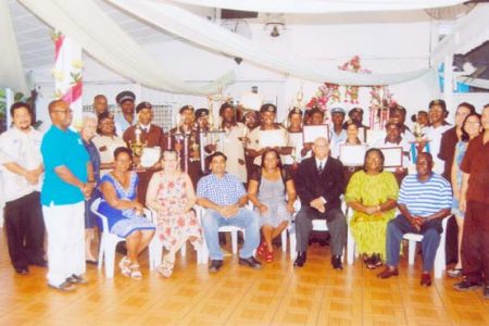 PGS staff and awardees display their certificates and awards at its Fourth Quarterly Presentation and Annual Awards on Saturday. PGS CEO Dougal Kirkpatrick is seated third from left.

