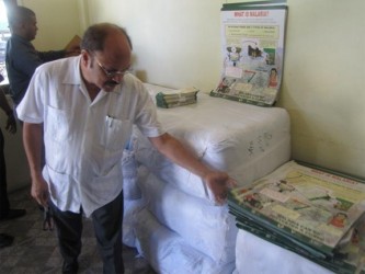 Health Minister Dr Bheri Ramsaran inspecting some of the educational material. (GINA photo)