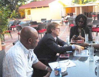 Guyana Goldfields Chief Executive Officer Patrick Sheridan (centre); Country Manager Violet Smith (right) and Human Resources Manager Peter Benny (left) during the interview.