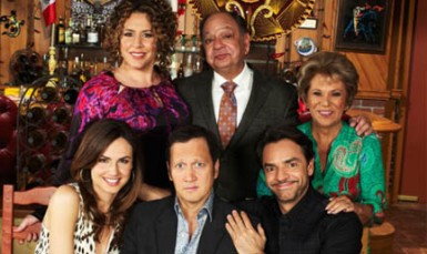  Rob Schneider (seated, centre) and the cast of “Rob”