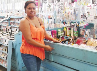 Babita Bhagwandin shows the broken locks on her stall