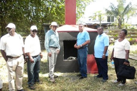 Minister of Natural Resources and the Environment Robert Persaud (third from left), Region Seven Chairman Gordon Bradford (third from right) and other officials in front of the new incinerator at Itaballi, Region Seven. (GINA photo)
