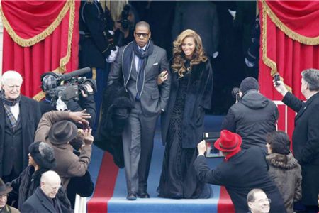 Recording artists Beyonce (R) and Jay-Z arrive ahead of the swearing-in ceremonies for US President Barack Obama on the West Front of the US Capitol in Washington, January 21, 2013. (Reuters/Jason Reed)