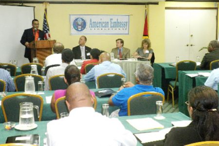 Minister of Natural Resources Robert Persaud addressing  participants at a US Department of the Interior and Bureau of Ocean Energy Management workshop yesterday.  Seated at the head table from left are US Embassy Economic and Commercial Officer Eric Moore, US Ambassador D. Brent Hardt and US Department of Interior official Cheri Hunter. 