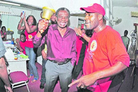 Orville London rings a bell as he celebrates victory in yesterday’s Tobago House of Assembly (THA) elections at the party’s Scarborough headquarters. London has secured a fourth term as THA Chief Secretary.
