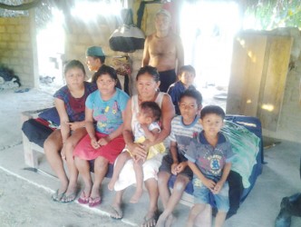 Eunice Stephen, her husband, Brutus Stephen and their grandchildren at their home at Parishara, Region Nine last week. 