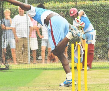 Fast bowler Andre Russell bowls to West Indies middle order batsman Ramnaresh Sarwan in the nets yesterday as the West Indies team prepares for its opening game against the Prime Minister’s XI led by Ricky Ponting today. (Photo courtesy of WICB media)