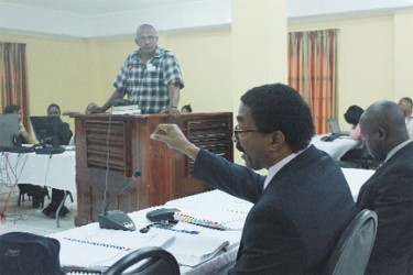 Ramchand Mangra as he was being crossed-examined by Basil Williams (foreground)