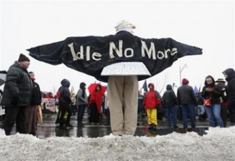 A First Nations protester dressed as an eagle takes part in a march towards Parliament Hill before the start of a meeting between chiefs and Canada's Prime Minister Stephen Harper in Ottawa January 11, 2013. Deep splits emerged in the ranks of Canada's aboriginal movement on Friday, casting doubt on a planned meeting between chiefs and Conservative Prime Minister Stephen Harper to discuss a series of native grievances. REUTERS/Chris Wattie