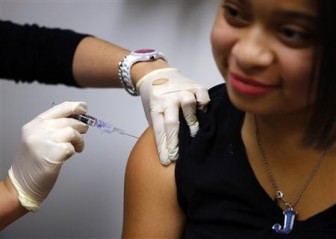 Jasmine Rodriguez, 10, gets an influenza vaccine at Boston Children's Hospital in Boston, Massachusetts January 10, 2013.Credit: Reuters/Brian Snyder