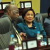 Prime Minister Kamla Persad-Bissessar during yesterday’s Parliament sitting at the International Waterfront Centre, Port of Spain. Looking on at left is National Security Minister Jack Warner