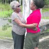 Marjorie Tsoi-a-Fatt , left, comforts her daughter Denise Tsoi-a-Fatt-Angus yesterday in Tobago (Trinidad Express photo)