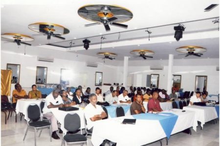 Participants at the Meeting.  At extreme left in the front row is Charles Corbin, a Gecom Commissioner. (Photo courtesy of Gecom)