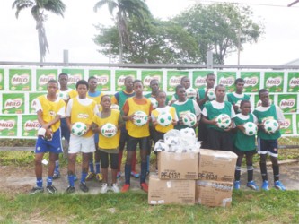 School Representatives receiving footballs