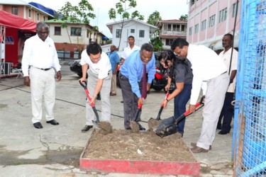 Prime Minister Samuel Hinds, Managing Director John Permaul, Mrs. Permaul and company officials turn the sod to mark the site for the construction of the new Honda Headquarters. (Government Information Agency photo)