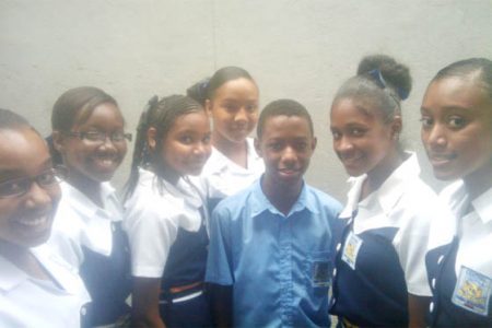 Central’s Third Form Group Leader, 14-year-old Terief McPherson flanked by Savannah Pearson and other group members.