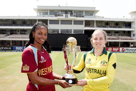 West Indies captain Merissa Aguilleira (left) Australia captain Jodie Fields pose with the trophy ahead of  today’s ICC Women’s World Cup Final. (Photo courtesy ICC tournament website)

