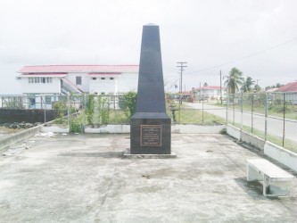 The Monument of Hope erected in honour of the 12 men killed during the Bartica massacre on February 17, 2008. When Stabroek News visited recently, the area around the monument was littered with garbage and faeces.