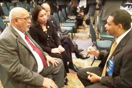 President Donald Ramotar (left) meets with Vice President of Suriname Airways Clyde Cairo (right) on the sidelines of the 24th Inter-Sessional Meeting of CARICOM Heads in Haiti. (GINA photo)