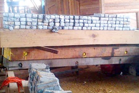 Some of the parcels of cocaine that were found in hollowed out timber logs which were being prepared for shipment to The Netherlands. They indicate meticulous preparation.
