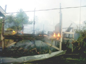 The burning building that used to be Bisham Singh’s home