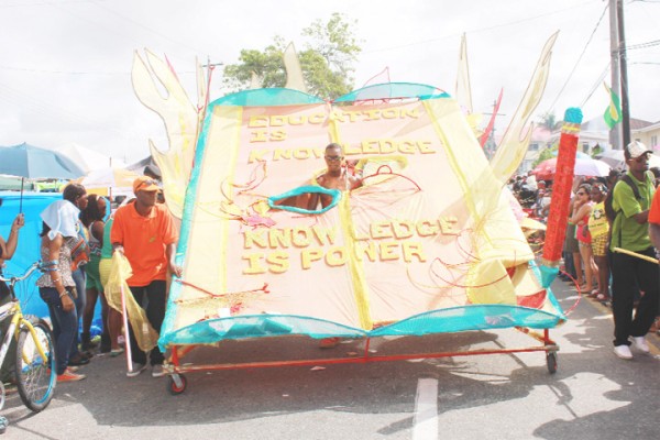 Book of knowledge: A float under the Ministry of Education’s costume band ‘Blazing the Trail of Knowledge’ during the Annual Mashramani Parade yesterday. (Photo by Arian Browne)