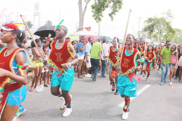Freedom bound: Revellers with the Ministry of Culture, Youth and Sport costume band ‘Slavery and Indentureship to Freedom’ doing their thing through the streets at yesterday’s Annual Mashramani Costume and Float Parade. (Photo by Arian Browne)