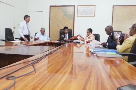 Minister of Finance Dr Ashni Singh (third from left) and Vice President of the Caribbean Development Bank (CDB) Carla Barnett (third from right) sign the two agreements at Ministry of Finance yesterday.
