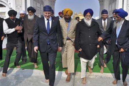 Britain’s Prime Minister David Cameron (4th R) walks inside the premises of the holy Sikh shrine of Golden temple in the northern Indian city of Amritsar February 20, 2013.
REUTERS/Munish Sharma