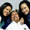 Venezuela's President Hugo Chavez smiles in between his daughters, Rosa Virginia (R) and Maria while recovering from cancer surgery in Havana in this photograph released by the Ministry of Information on February 15, 2013. REUTERS/Ministry of Information/Handout