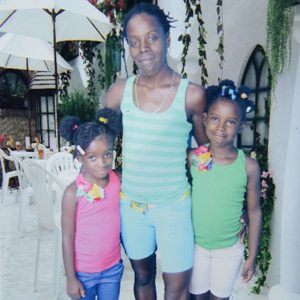 Hady Paul and her two children, Shakira, 7, left, and Akasha, 8. (Trinidad Express photo)