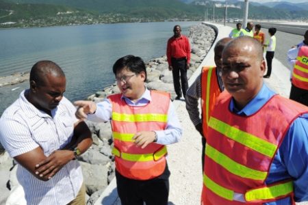 State Minister for Transports Works Richard Azan (right) and other officials during a tour of the Palisadoes Shoreline project which was constructed by China Harbour- File Photo 
