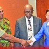Prime Minister Kamla Persad-Bissessar greets acting Police Commissioner Stephen Williams, left, before yesterday’s meeting with heads of the Protective Services in the Parliament conference room, Port of Spain International Waterfront Centre. Looking on are National Security Minister Jack Warner, centre, and Major General Kenrick Maharaj.