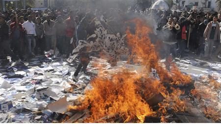 Demonstrators burn documents of the Ennahda party, outside the party’s headquarters, during a demonstration in Gafsa February 6, 2013.
REUTERS/Stringer