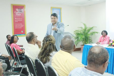 Professor Miguel Carrillo, Executive Director and Professor of Strategy at the Arthur Lok Graduate School of Business, University of the West Indies (standing) addressing the Republic Bank SME clients.  (Photo by Arian Browne)
