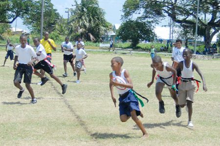 Action during North Georgetown Secondary School ‘A’ Team’s victory over Covent Garden yesterday at the National Park Rugby field. (Orlando Charles photo)
