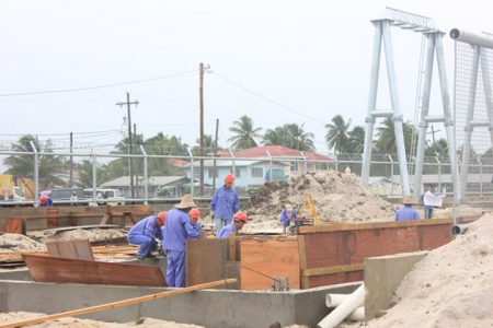 Some of the Chinese labourer at work at the Guyana Power and Light sub-station at Good Hope, East Coast Demerara during a site visit by Stabroek News last month. 