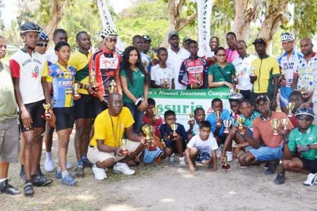 Winners and runners-up of the inaugural Assuria Insurance Company cycle programme pose with their spoils upon completion of yesterday’s event.