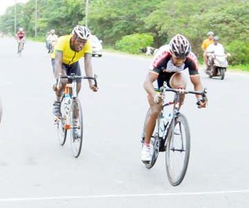 Robin Persaud edges Orville Hinds to take yesterday’s annual Cheddi Jagan Memorial Krishna Ramlall Sawmills sponsored 50-mile road race. (Orlando Charles photo)

