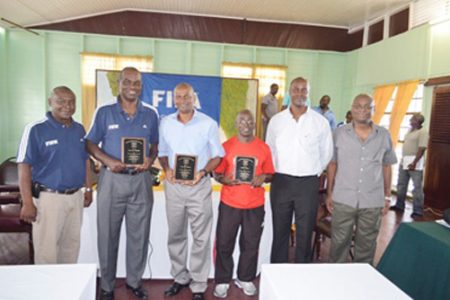 Three of the officials – Lawrence Griffith, Roy Mc Arthur and Collin Aaron (holding plaques) with GFRC President Alfred King, Treasurer Dwayne Lovell and Secretary Troy Peters.