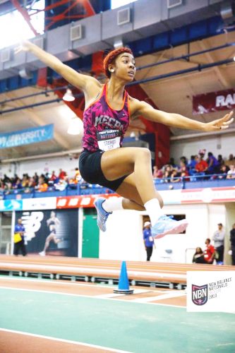 Former sprinter Ashley Tasher gracefully soars through the air in the long jump competition at the New Balance Nationals earlier this year. Tasher will be representing Guyana at the CARIFTA Games in Bahamas this month end.