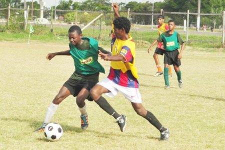 Action in the Milo Schools football between St.  George’s and Charlestown yesterday