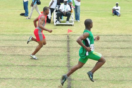 Tevin Garraway (right) returned to the track and field arena yesterday with an emphatic 100m win in 10.6s to comfortably defeat Kevin Abbensetts at the Guyana Defence Force ground (GDF), Camp Ayanganna yesterday. (Orlando Charles photo)