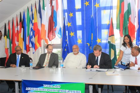 (From left) IICA’s Representative in Trinidad and Tobago Gregg Rawlins, Caricom Secretary General Irwin La Rocque, President Donald Ramotar, Head of the EU Delegation Ambassador Robert Kopecky and Minister of Agriculture Leslie Ramsammy at yesterday’s signing.  (Photo by Arian Browne)