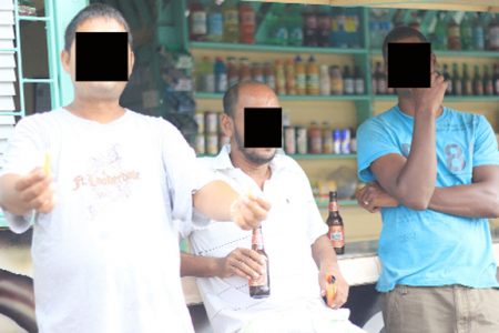 These men were having an afternoon beer at a city spot.
