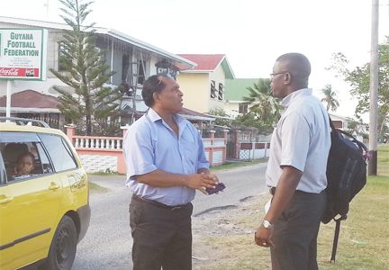 Ivan Persaud, left and Rawle Adams await their  turn to be interviewed by the Electoral Committee. (Iva Wharton photo)