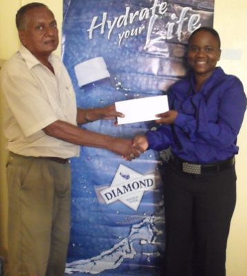 National Cycling Coach, Hassan Mohamed collects the sponsorship cheque from DDL Sales Manager, Alexis Langhorne.