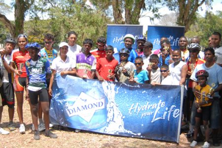 Winners and runners up pose with their respective prizes upon completion of yesterday’s 8th annual Diamond Mineral Water race meet.